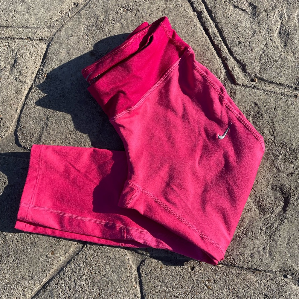 Pink Nike Dri Fit capri leggings.